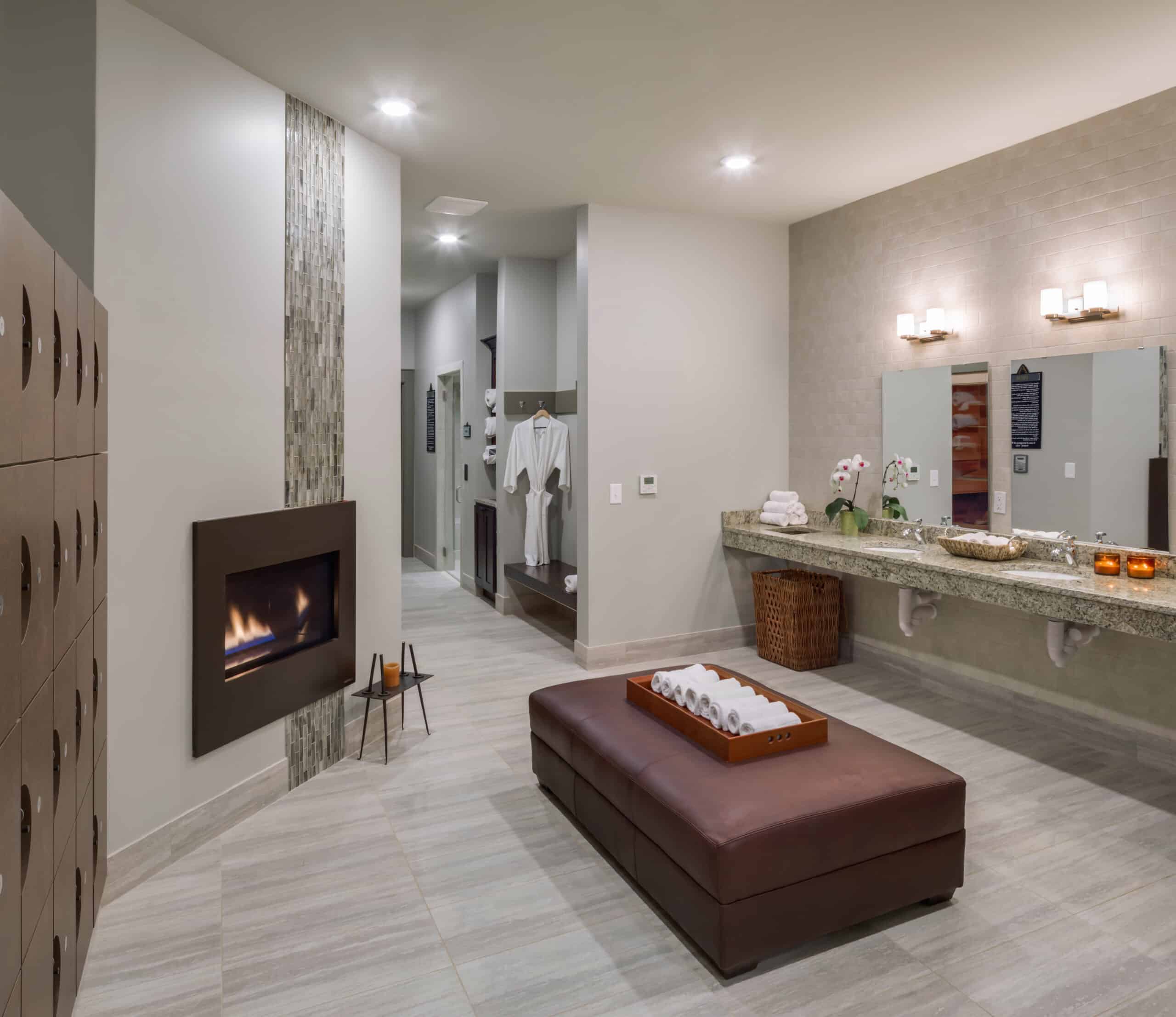 A bathroom with two sinks and a fireplace.