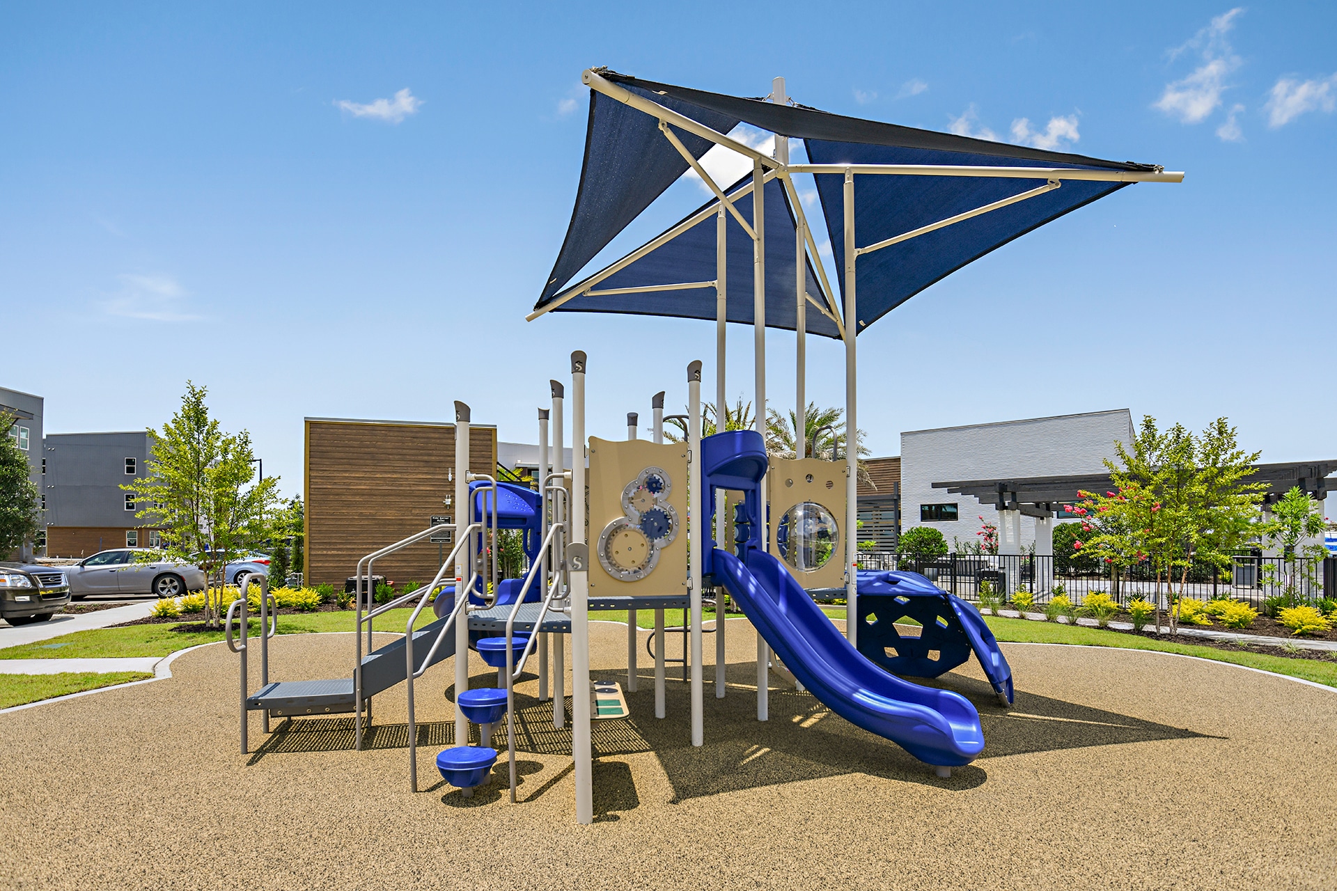 A playground with a blue slide.