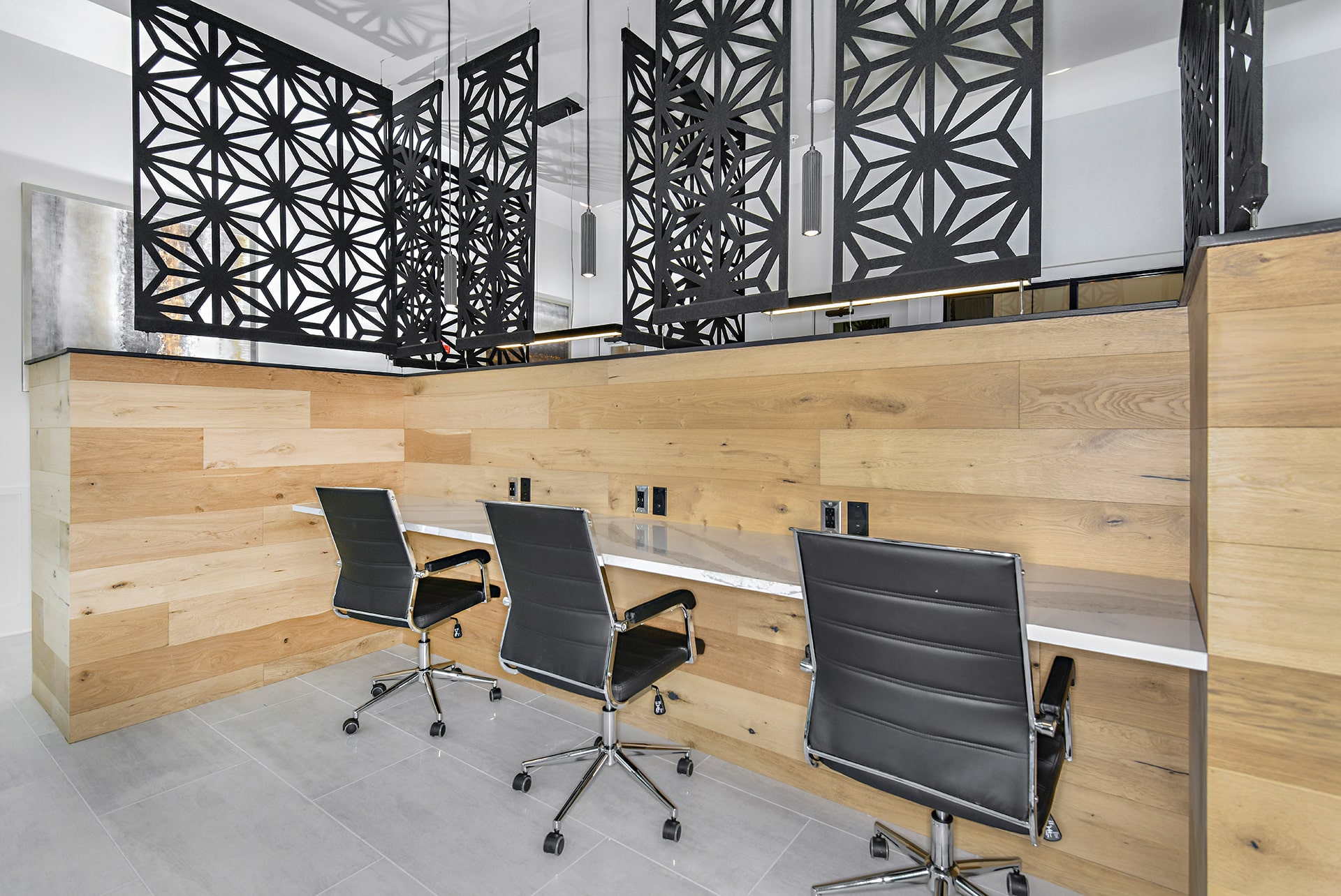 An office with a wooden desk and chairs.