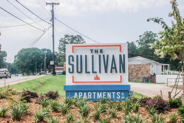 A sign for the sullivan apartments.