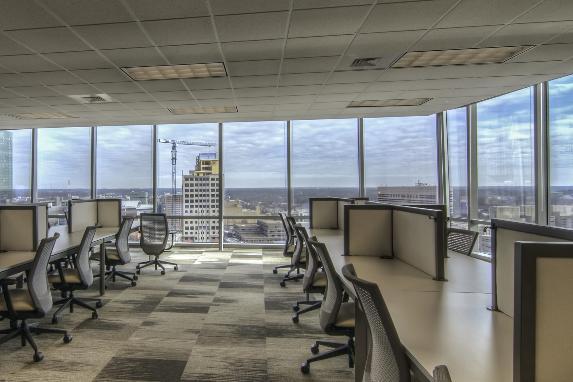 An empty office with a view of a city.
