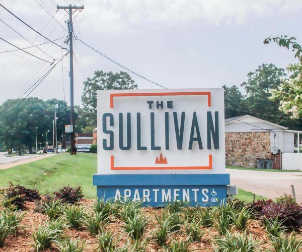 A sign for the sullivan apartments.